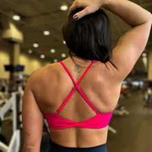Load image into Gallery viewer, Person wearing a pink sports bra and black leggings in a gym setting